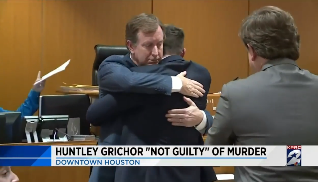 Huntley Grichor hugging Chris Flood after verdict of not guilty announced