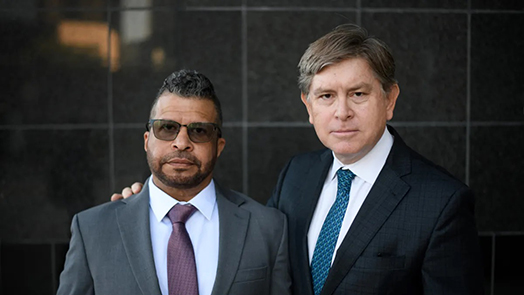 Charles Flood with Mohamed Mokbel